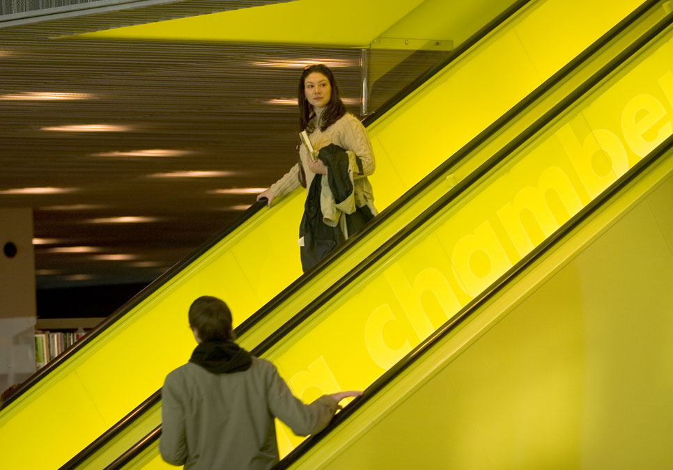 Patrons on the escalator at the Central Library