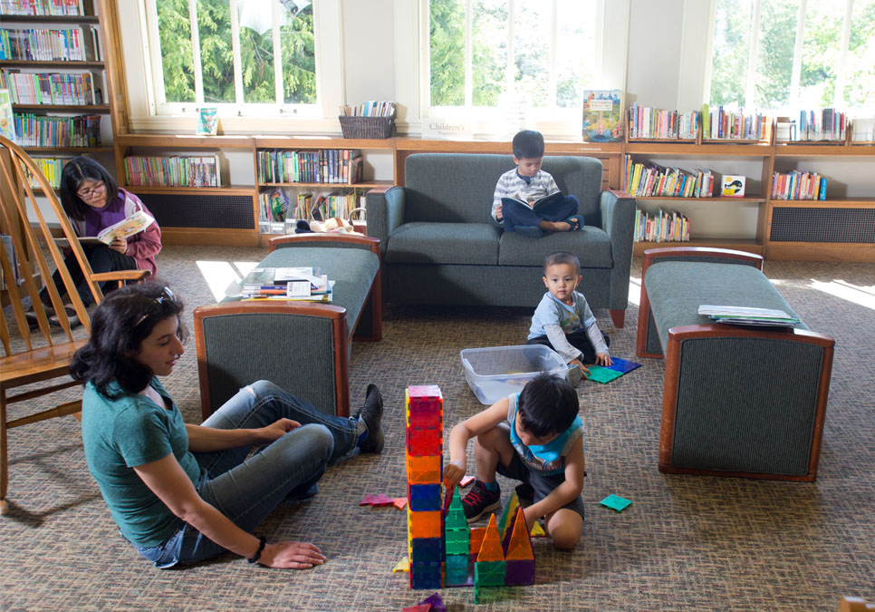 Children playing in children’s area at the Green Lake Branch