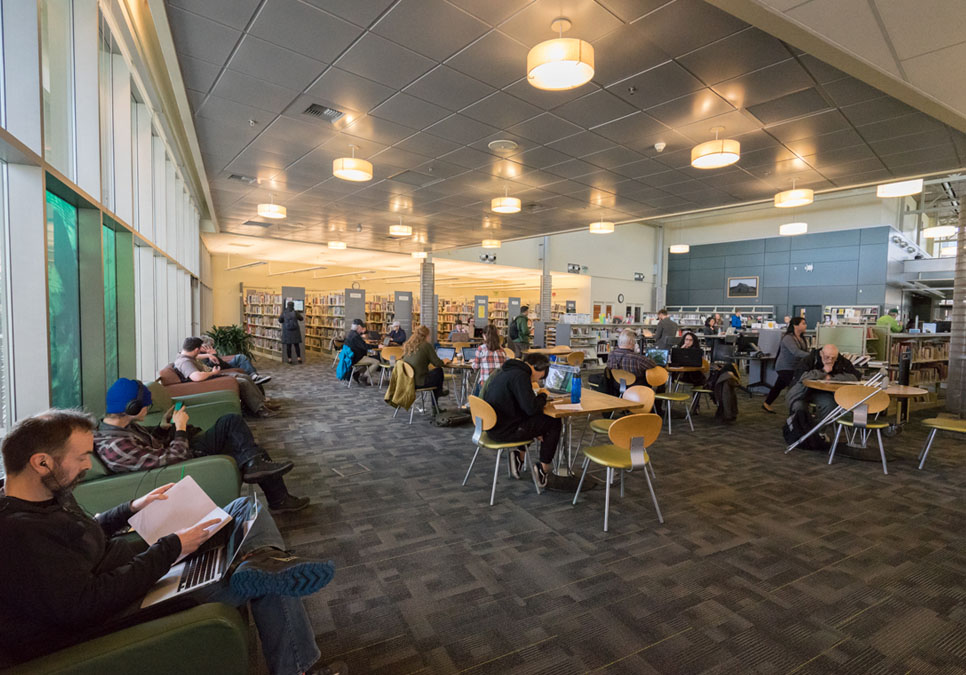 Library patrons in seating area at the Greenwood Branch