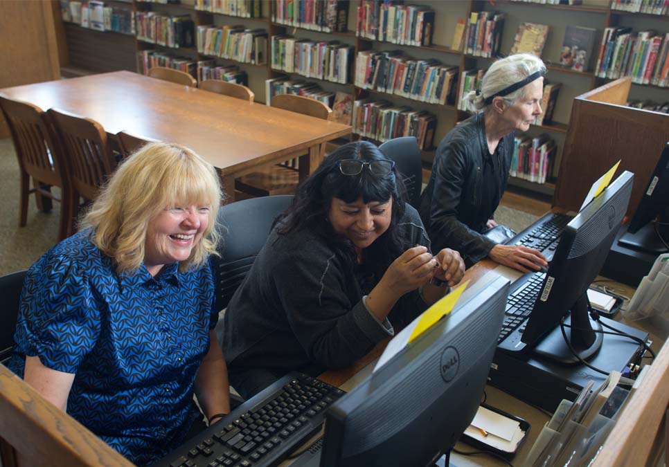 Library patrons using public computers at the West Seattle Branch