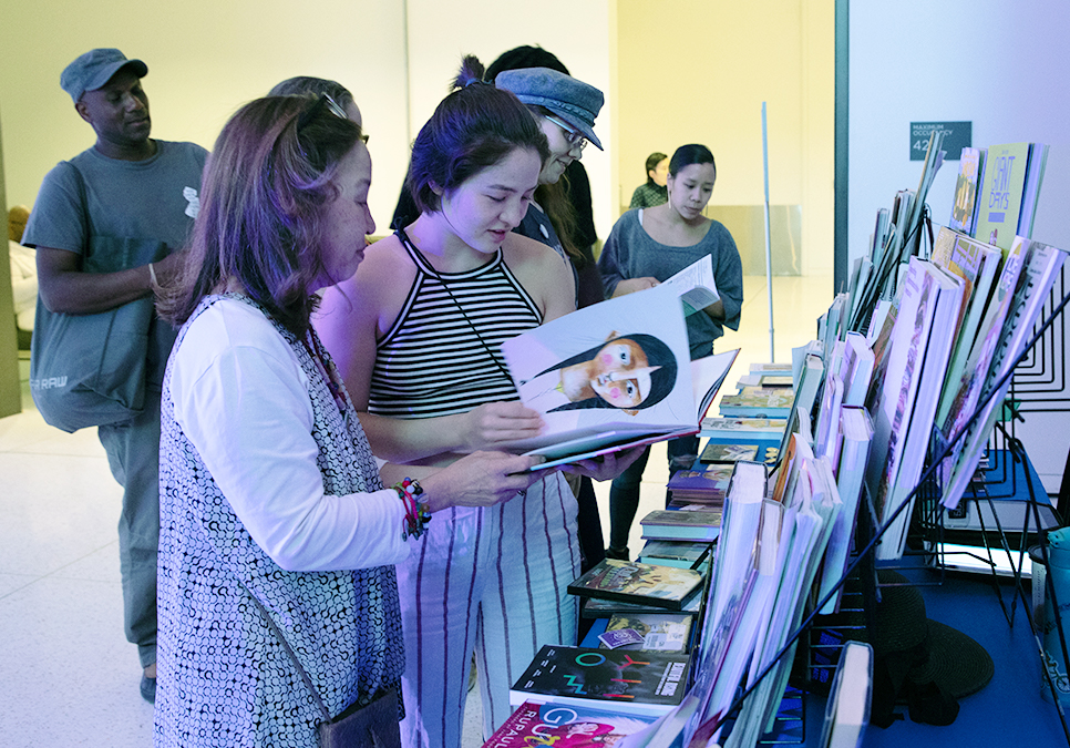 Guests checking out books at legendary children event at the Seattle Art Museum in 2019