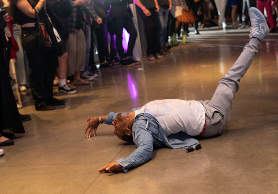 A person dances on the floor at the Legendary Children event at the Olympic Sculpture Park in 2022