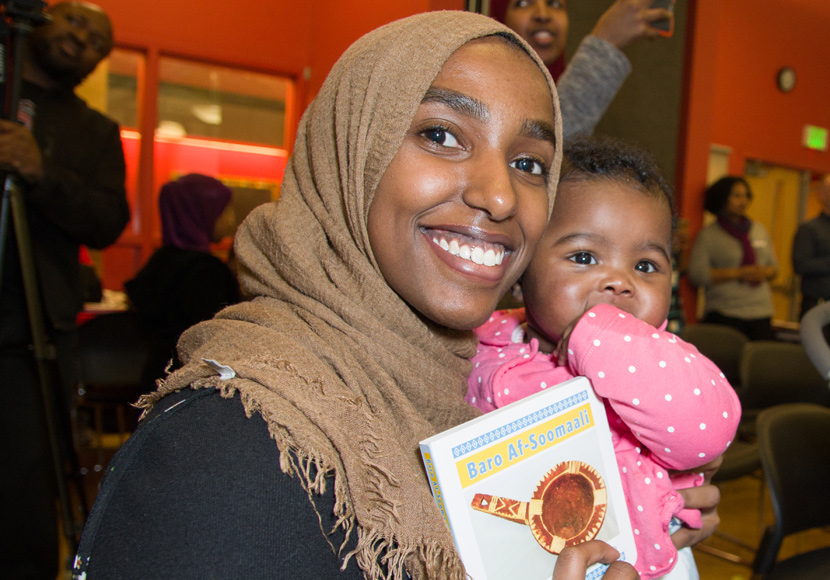 patron with baby at the somali book launch